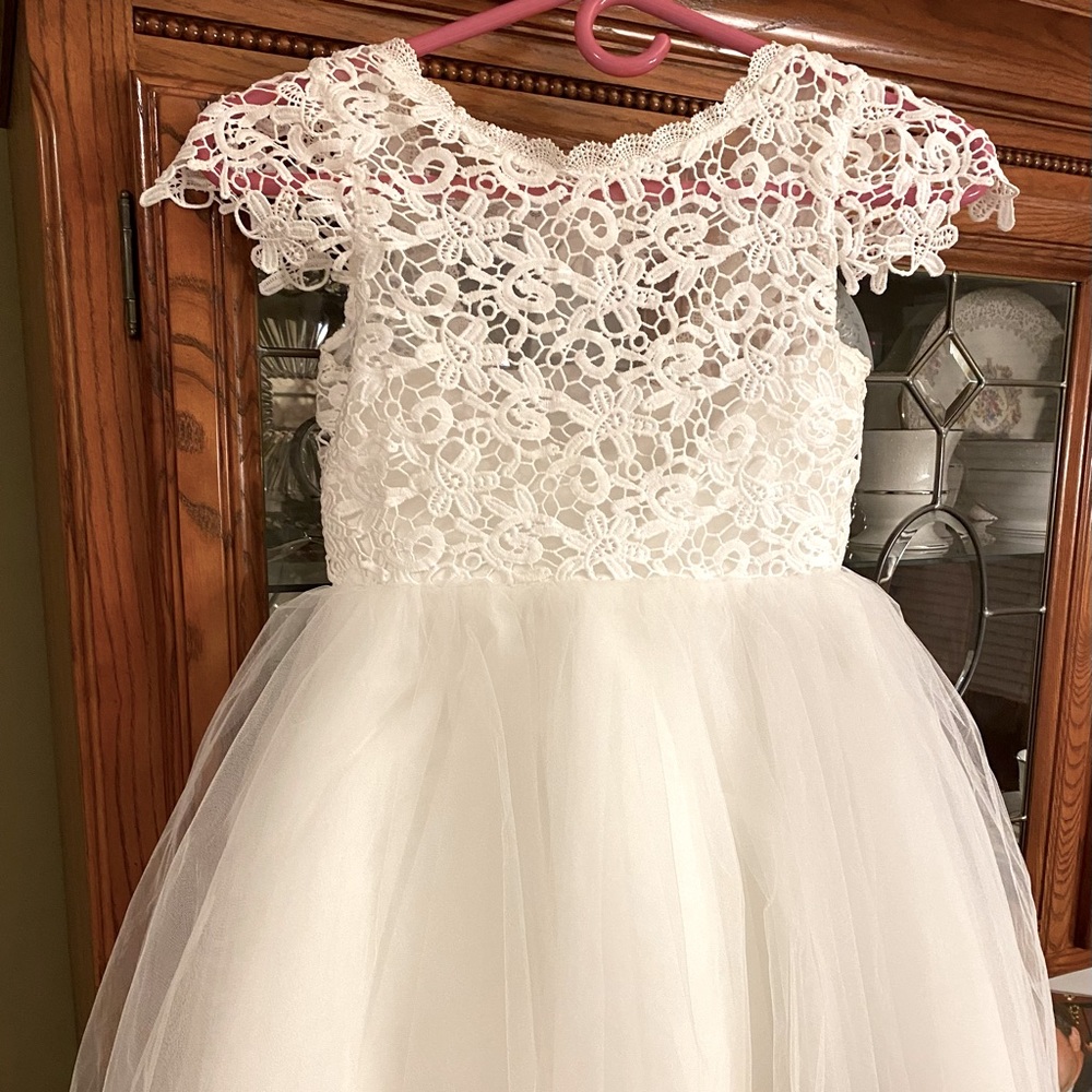 Stunning white lace and tulle dress with removable navy sash.